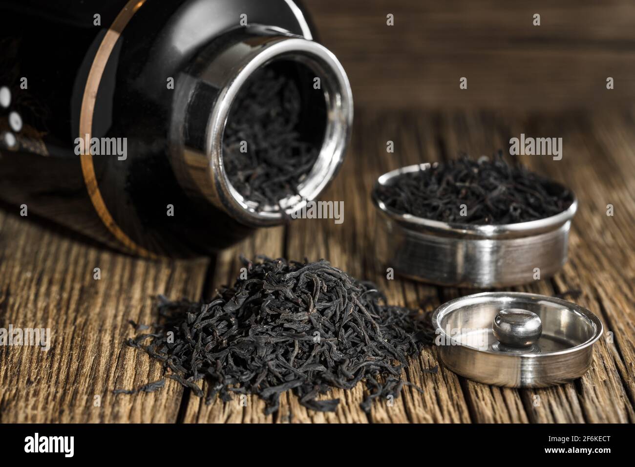 Black tea big leaf on the old wooden rustic table Stock Photo