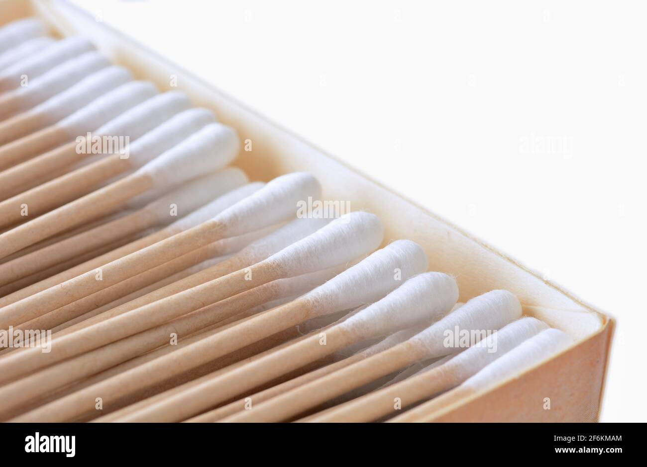 Closeup of the box full of ecological recyclable cleaning cotton swabs from recycled paper. It used for better environmental conservation. Cotton swab Stock Photo