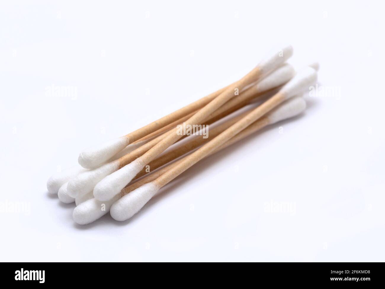 A heap of ecological recyclable cleaning cotton swabs from recycled paper. It used for better environmental conservation. Cotton swabs on white backgr Stock Photo