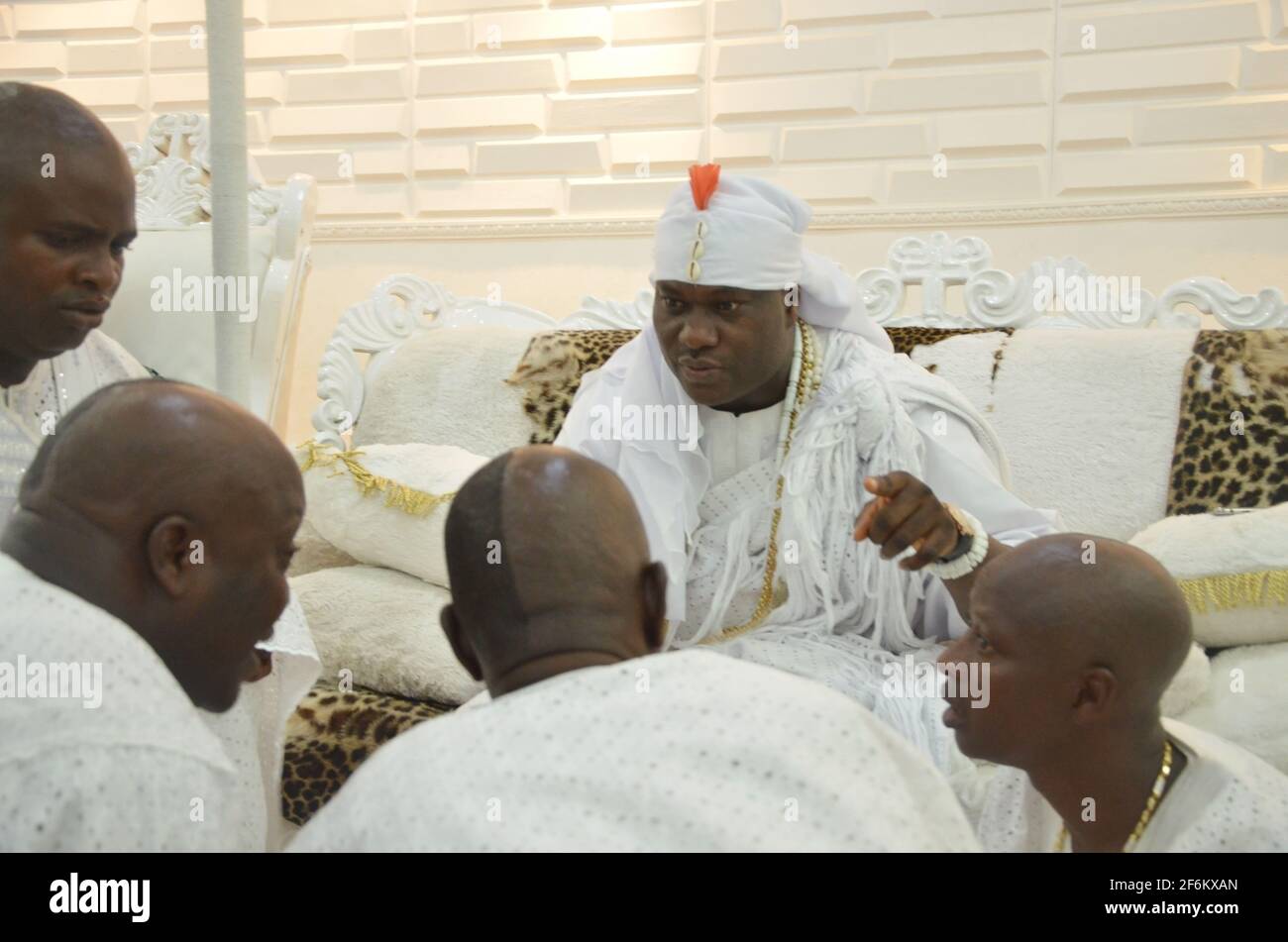 Ooni of Ife, Oba Adeyeye discussing with his palace chiefs (Emese) after seven-day seclusion to commune with the ancestors during the Olojo Festival. Stock Photo