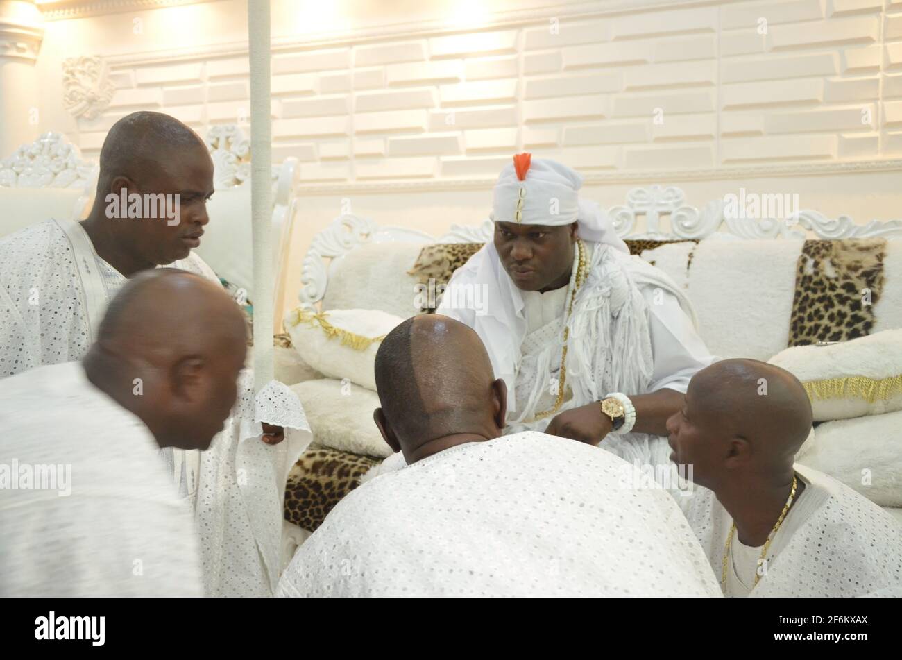 Ooni of Ife, Oba Adeyeye discussing with his palace chiefs (Emese) after seven-day seclusion to commune with the ancestors during the Olojo Festival. Stock Photo