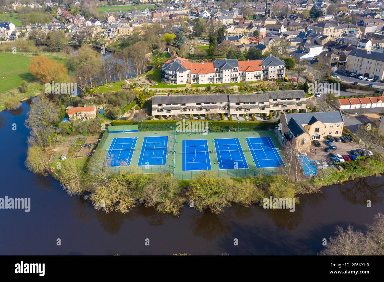 Aerial photo of the beautiful village of Wetherby in the UK showing rows of tennis courts near the river Stock Photo