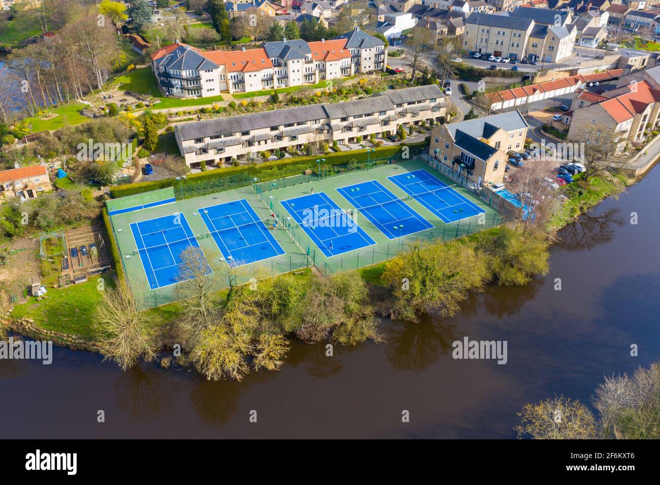 Aerial photo of the beautiful village of Wetherby in the UK showing rows of tennis courts near the river Stock Photo