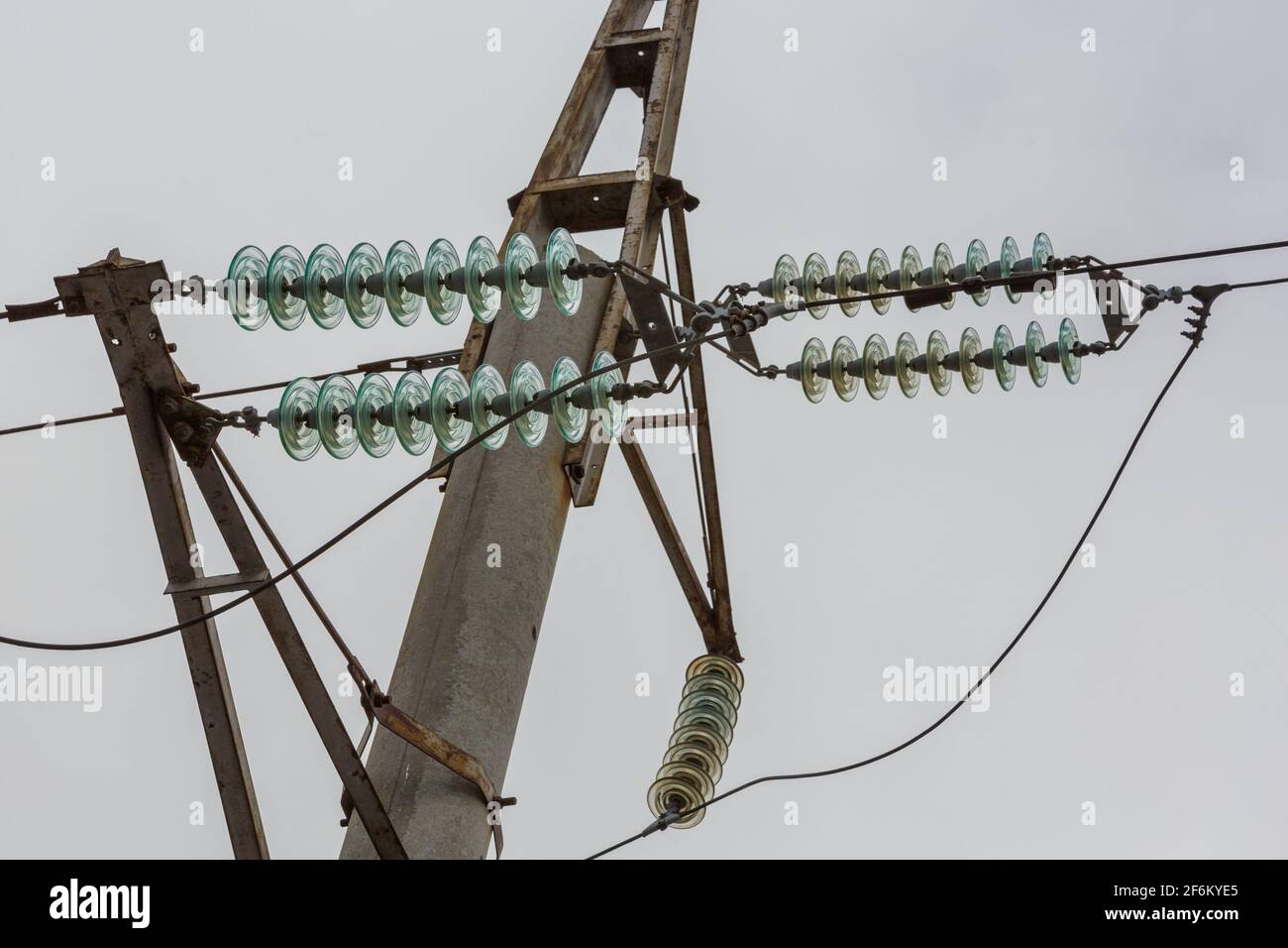 High voltage power line pole with glass electrical insulators on wires ...