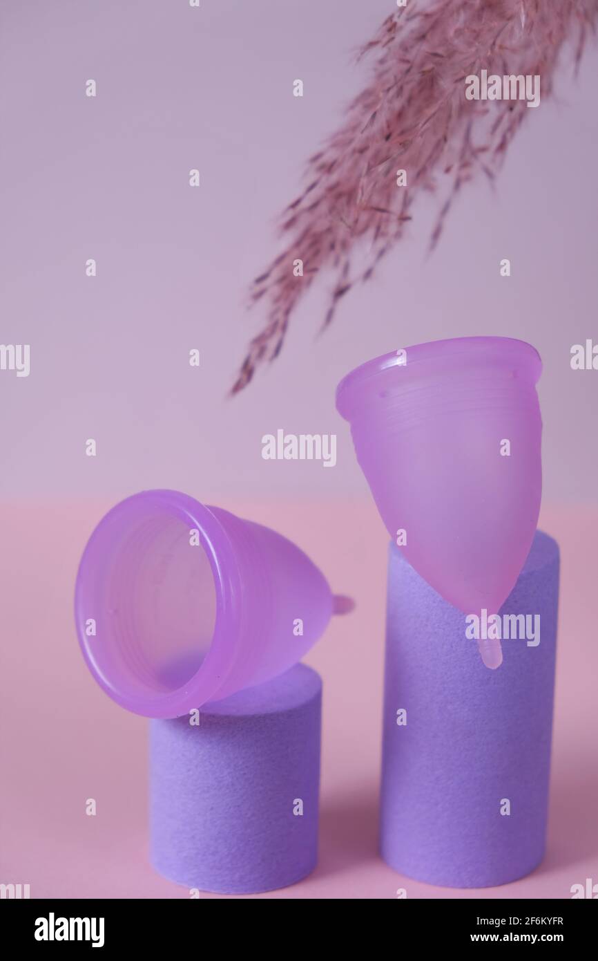 Menstrual cup. Women's health concept.Menstrual period. Two menstrual