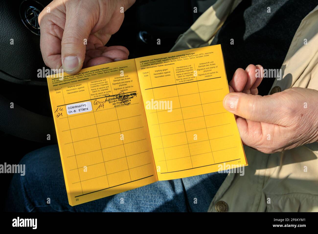 Dortmund, North Rhine-Westphalia, 1st April 2021. A man holds his vaccination booklet, showing today's jab of Pfizer-Biontech's (EU trade name 'Comirnaty' ) Covid 19 vaccine. Germany's vacchination campaign is finally gaining some pace with those in their 70s (and 60s in some areas), as well as teachers and nursery staff, medical, care and therapy workers, hairdressers and keyworkers all receiving their jabs. Credit: Imageplotter/Alamy Live News Stock Photo