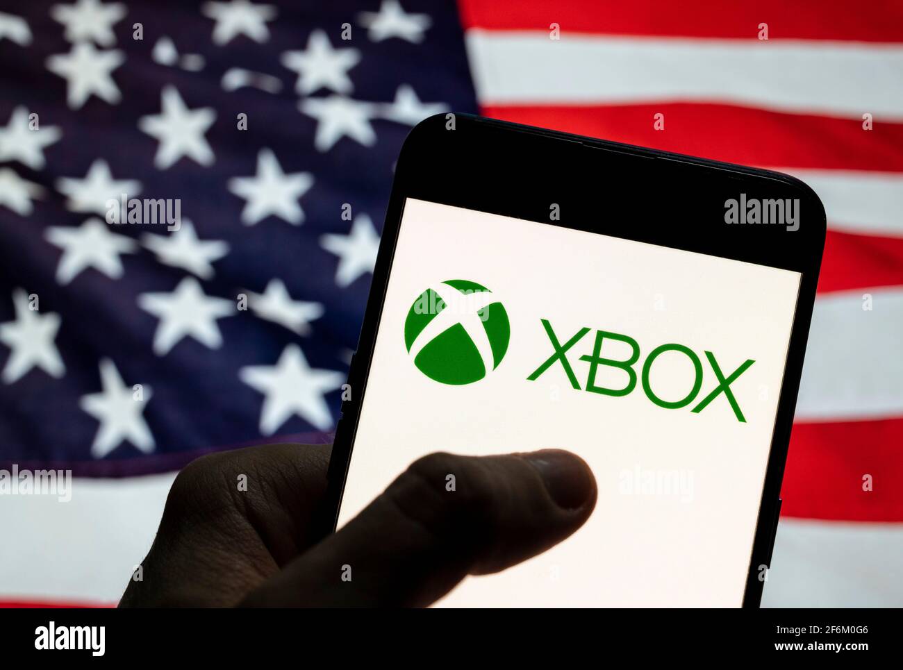 In this photo illustration the American video gaming brand created and  owned by Microsoft, Xbox, logo is seen on an Android mobile device with United  States of America (USA), commonly known as