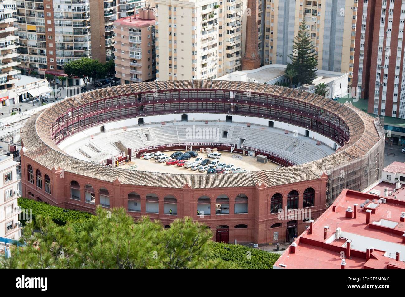 Bull ring in city center Malaga, Spain. Historic round Colosseum with outdoor seats where the popular bull fighting is viewed Stock Photo