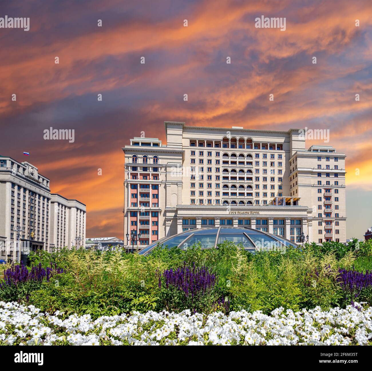 Facade of Four Seasons hotel (Hotel Moskva) from Manege Square on a  beautiful sky with cloud before sunset background. Moscow, Russia Stock  Photo - Alamy