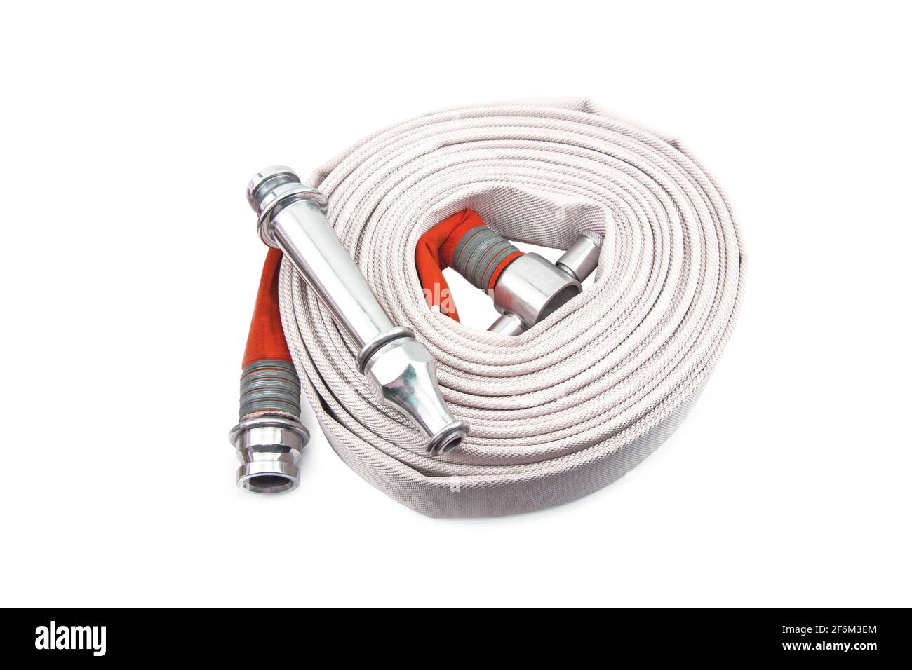 The red fire hose is isolated on the white background. Stock Photo