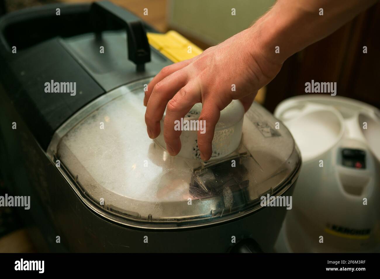 The process of cleaning carpets with a steam vacuum cleaner. Equipment