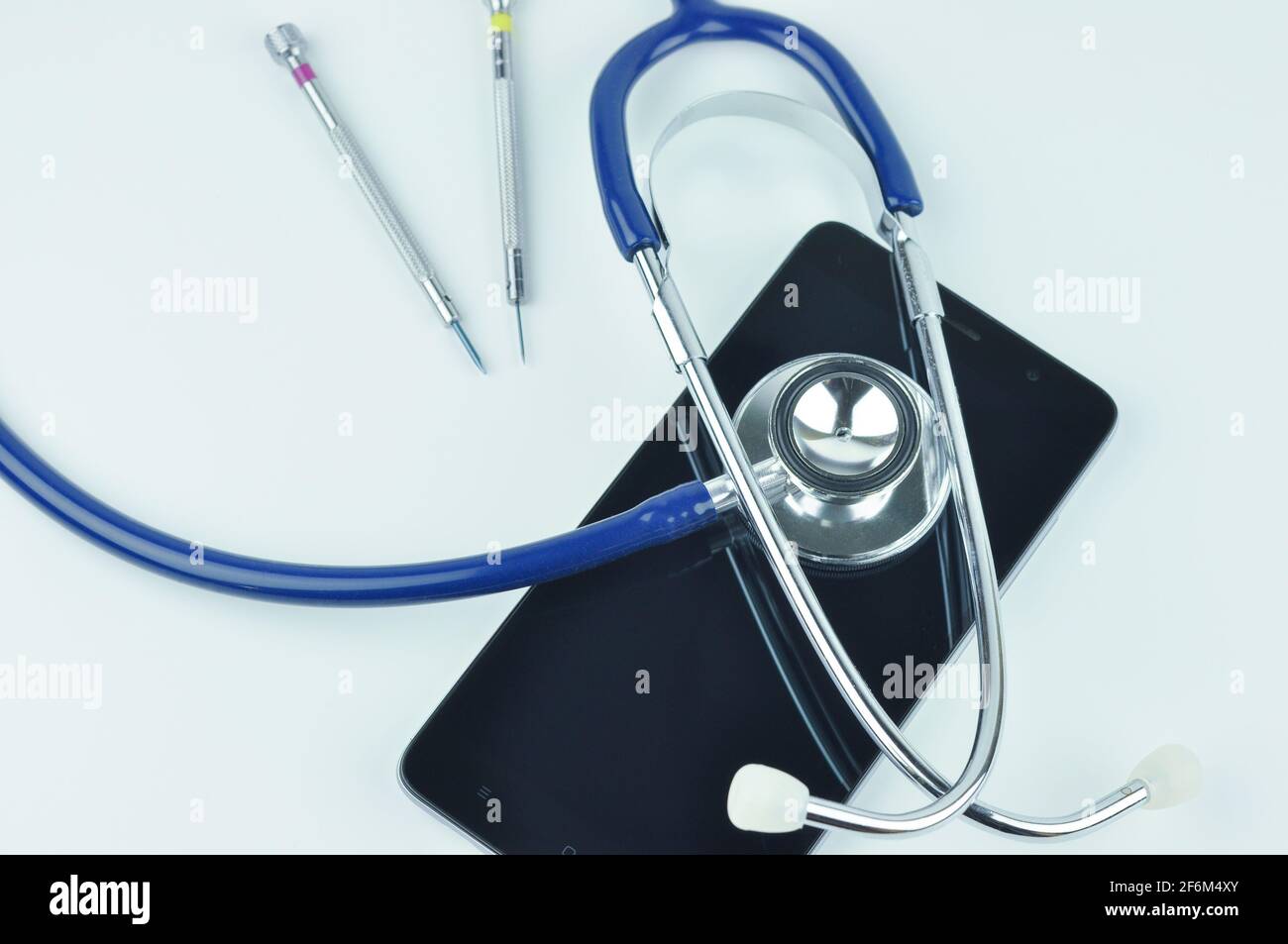 Stethoscope, smartphone and screwdrivers. Smartphone diagnostic, repair
