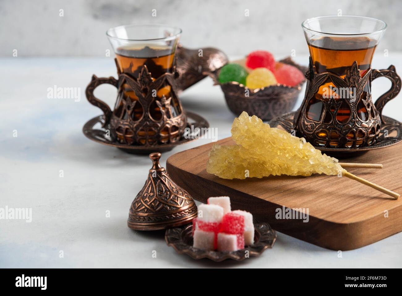 Close up photo of Turkish tea set. Sweet candies and fragrant tea Stock Photo