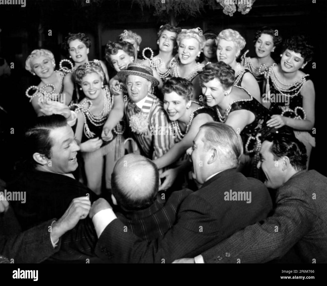 CITIZEN KANE 1941 RKO Radio Pictures film - the Inquirer party scene with Orson Welles at left and chorus girls led by Charles Bennett. Stock Photo