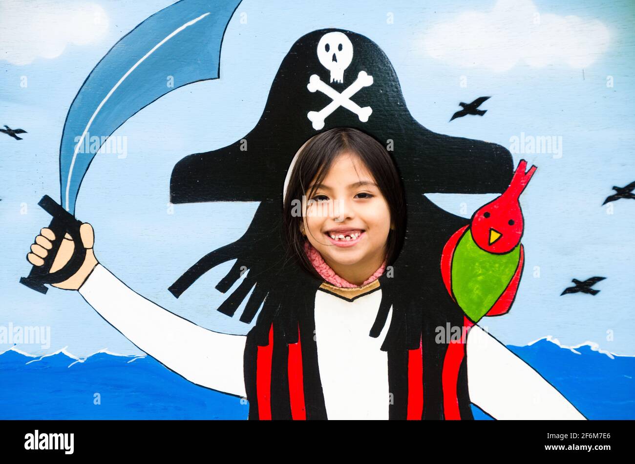 Image of a beautiful girl playing make an evil pirate. Stock Photo