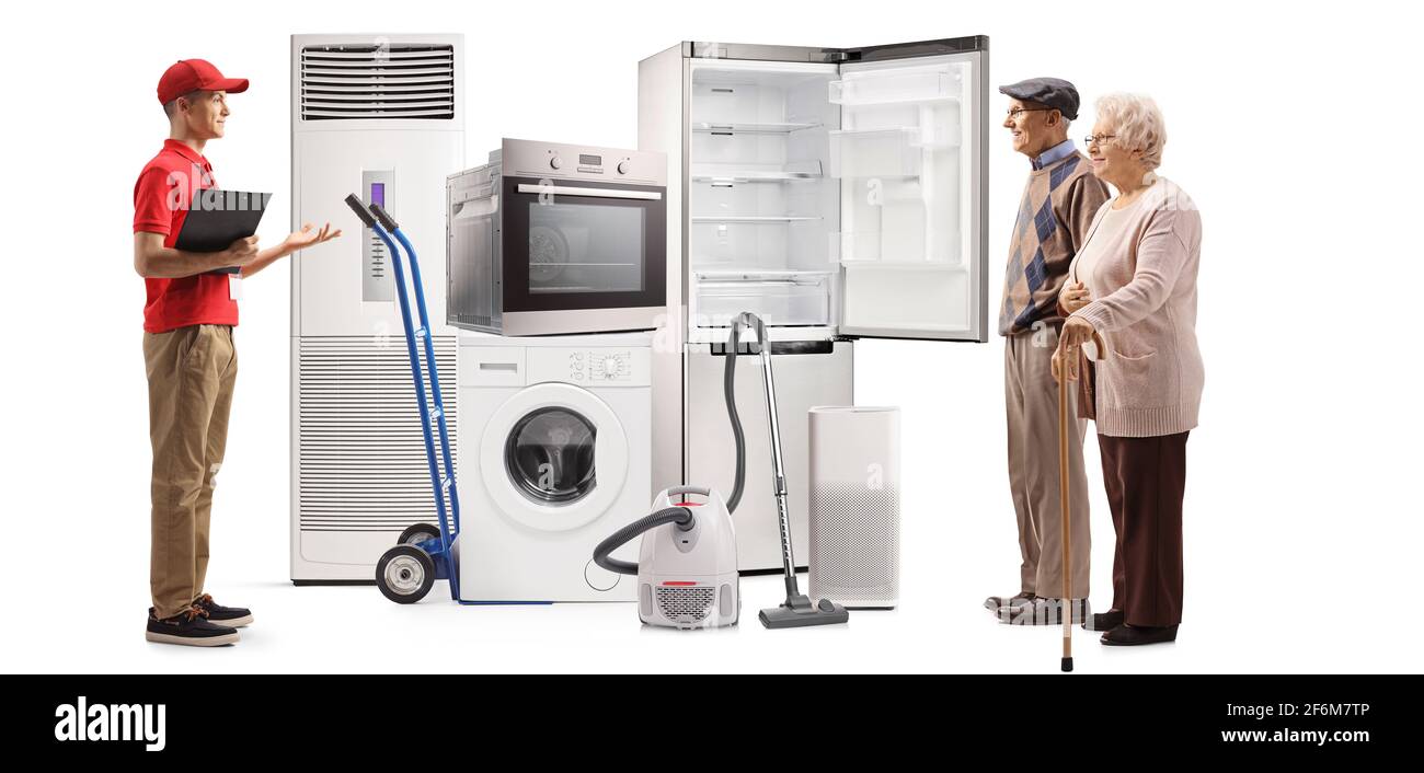 Elderly couple looking at home appliances in a store isolated on white