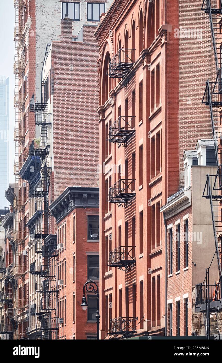 New York old buildings with fire escapes, color toning applied, USA ...