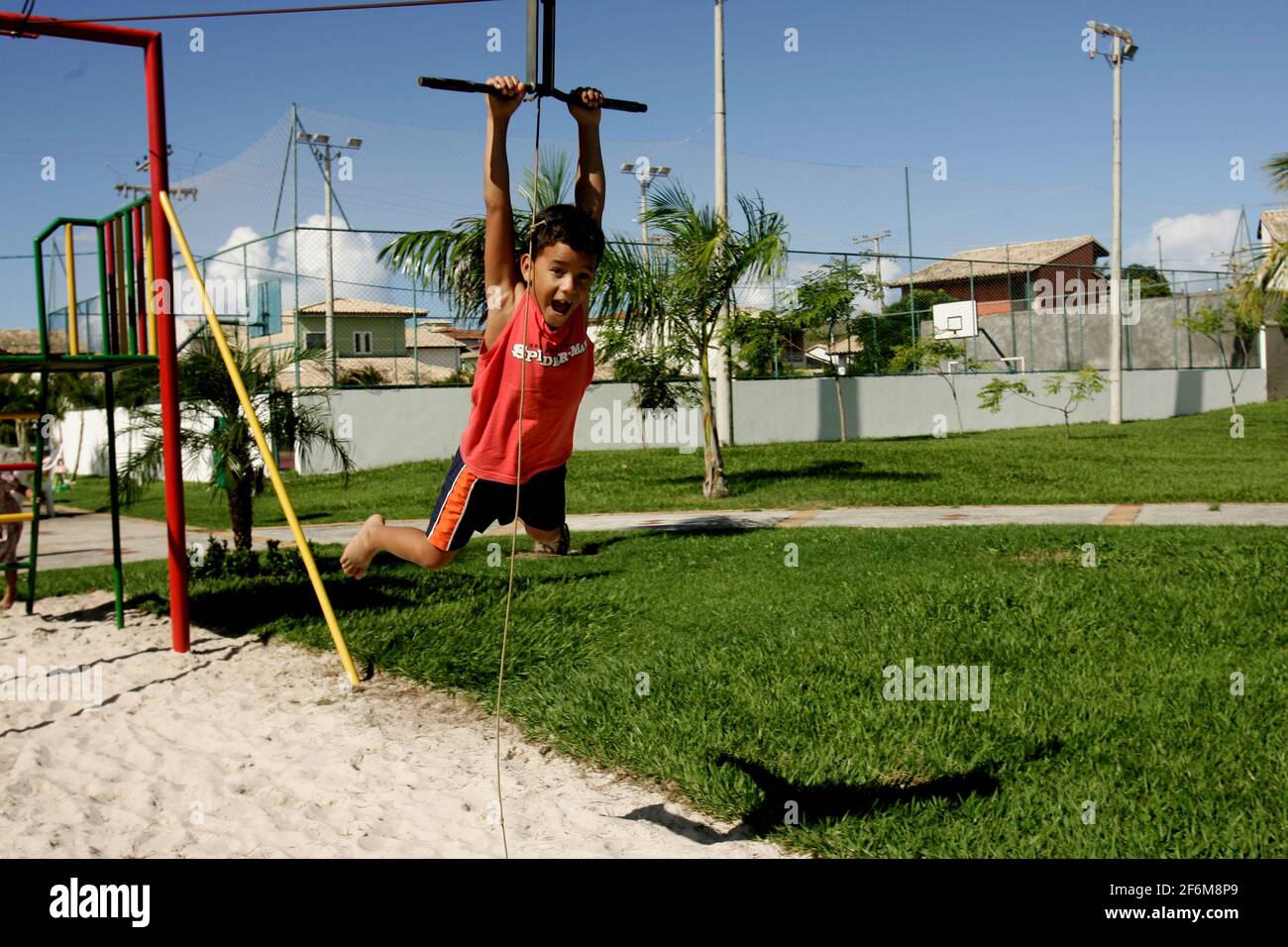 salvador, bahia / brazil - june 27, 2009: child is seen playing on zip lines in a condominium boat in the city of Salvador. Stock Photo
