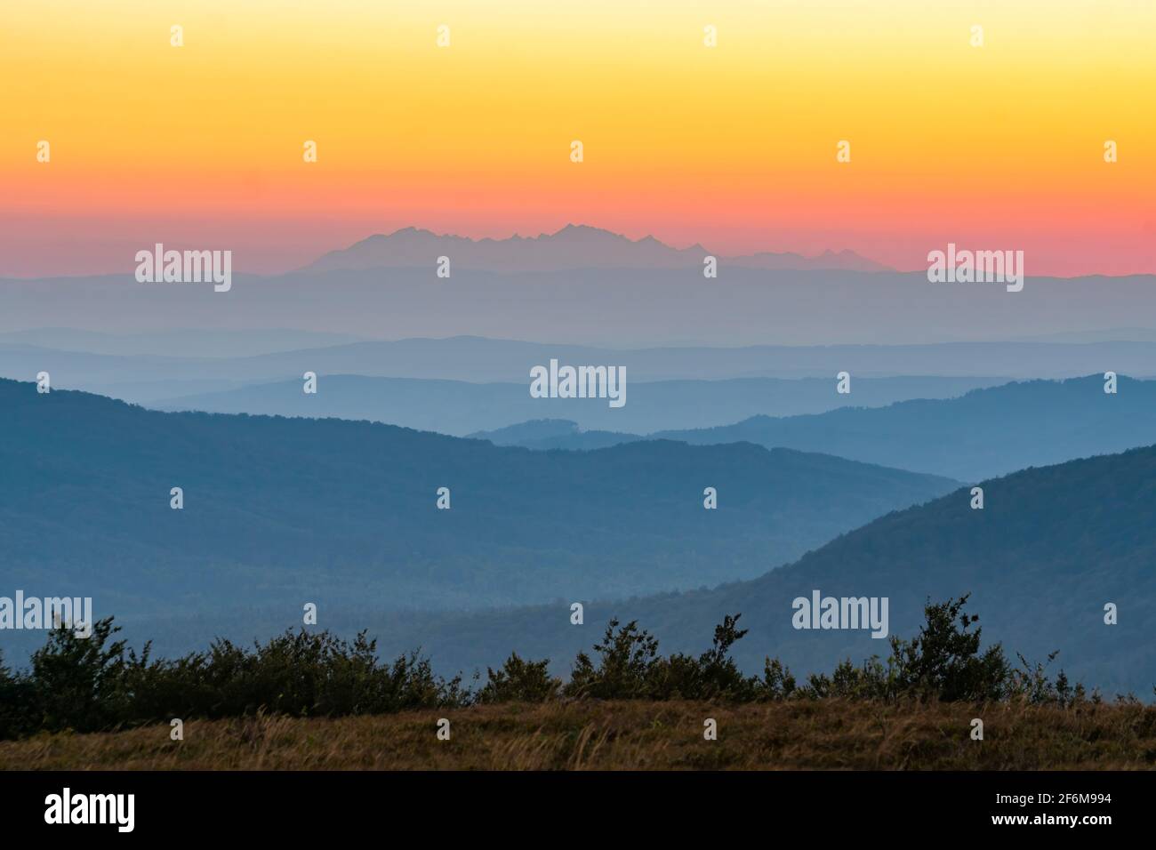 View of the sunset over the Tatra Mountains from the Jaslo peak in the Bieszczady Mountains. Poland, Europe Stock Photo