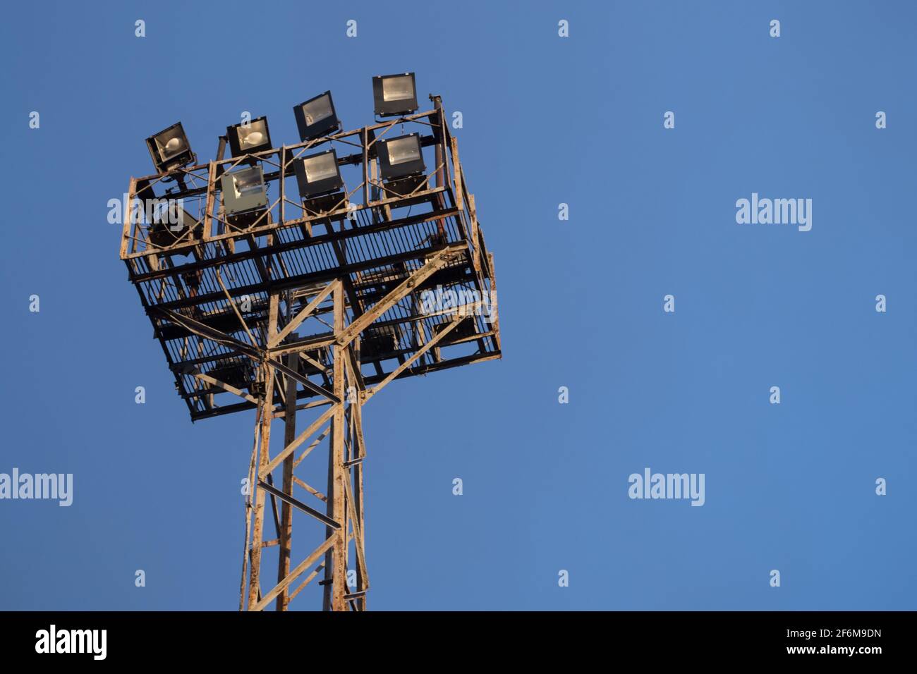 Old spotlight on a rectangular worn metal frame mounted on a shabby ...
