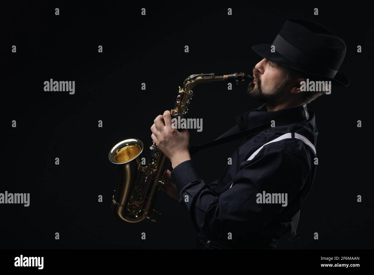Male artist using saxophone Stock Photo Alamy