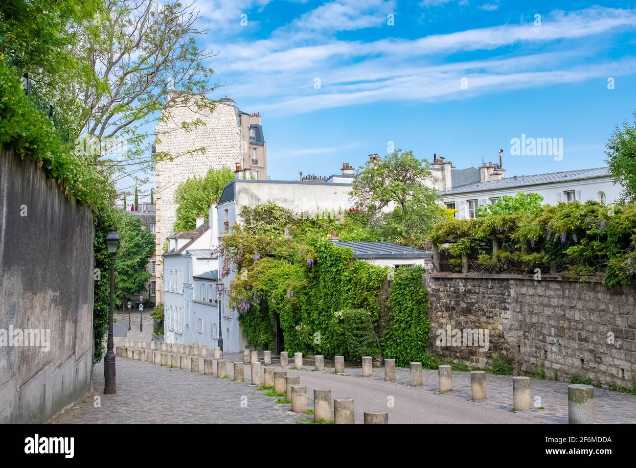 Paris, typical cobblestone street of Montmartre, a house with a