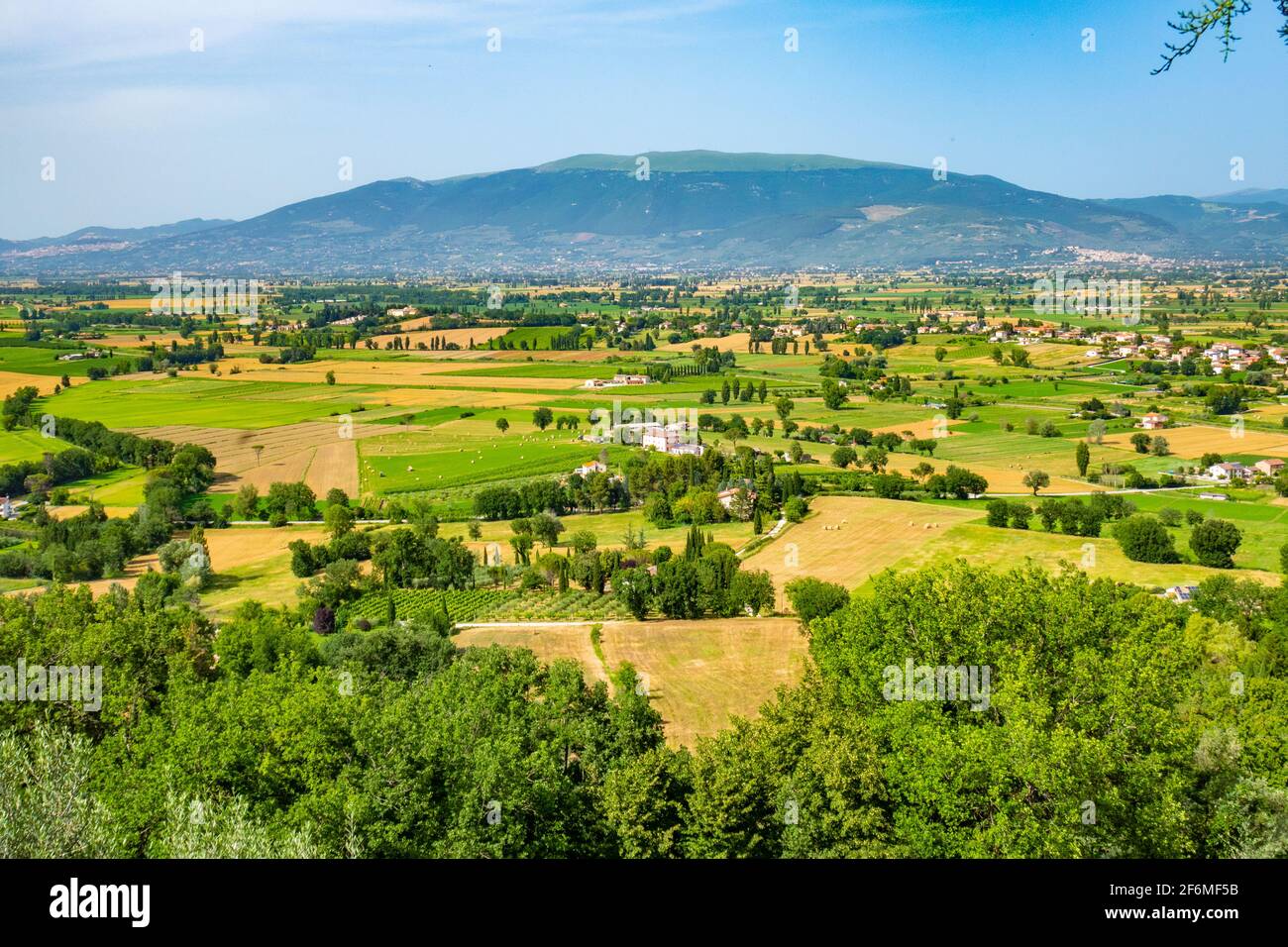 The Spoleto plain from the town of Gualdo Cattaneo, Terni, Umbria, with Assisi in the distance Stock Photo