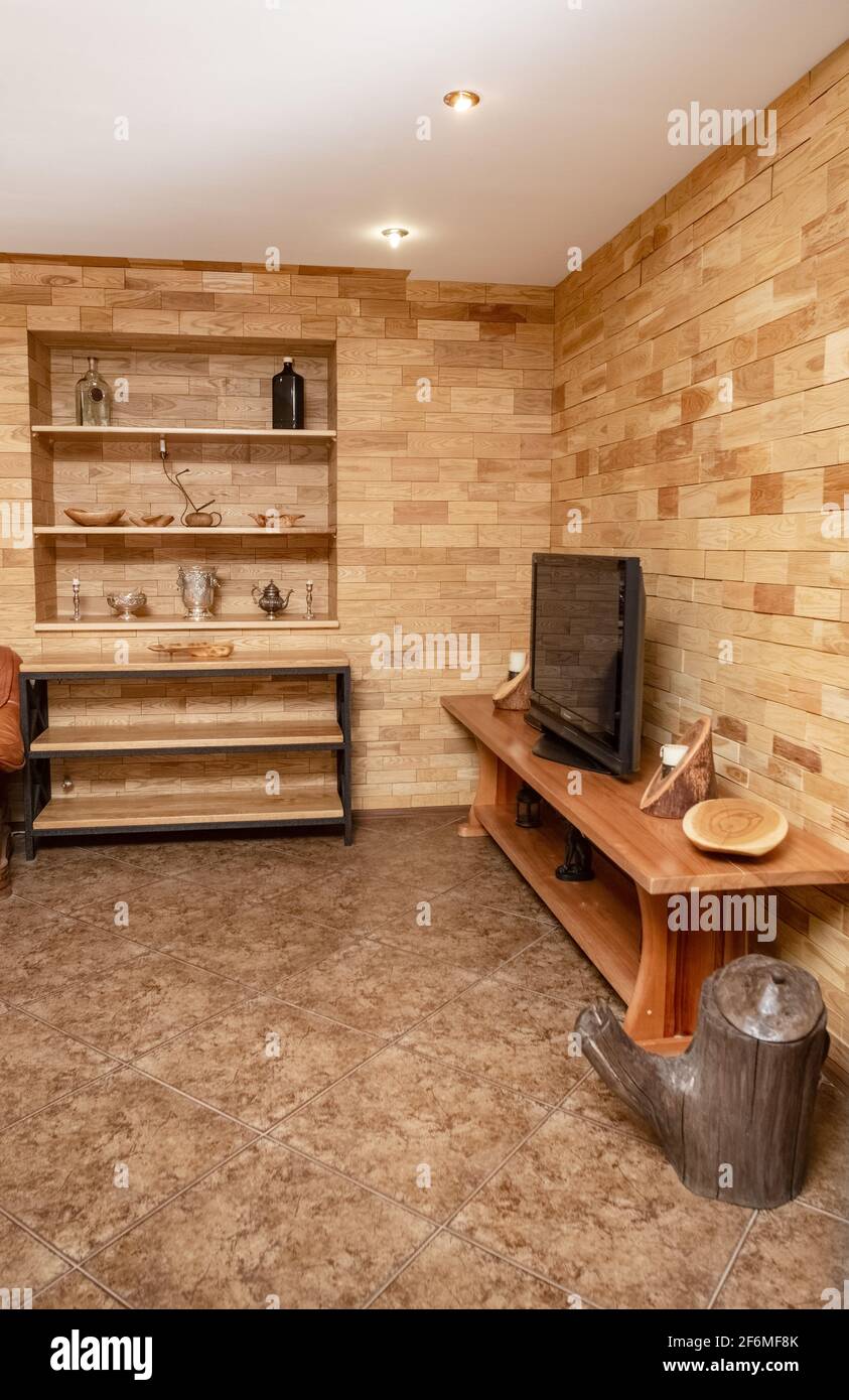 Walls covered with tiles made of valuable wood. Handmade wood products. Stock Photo