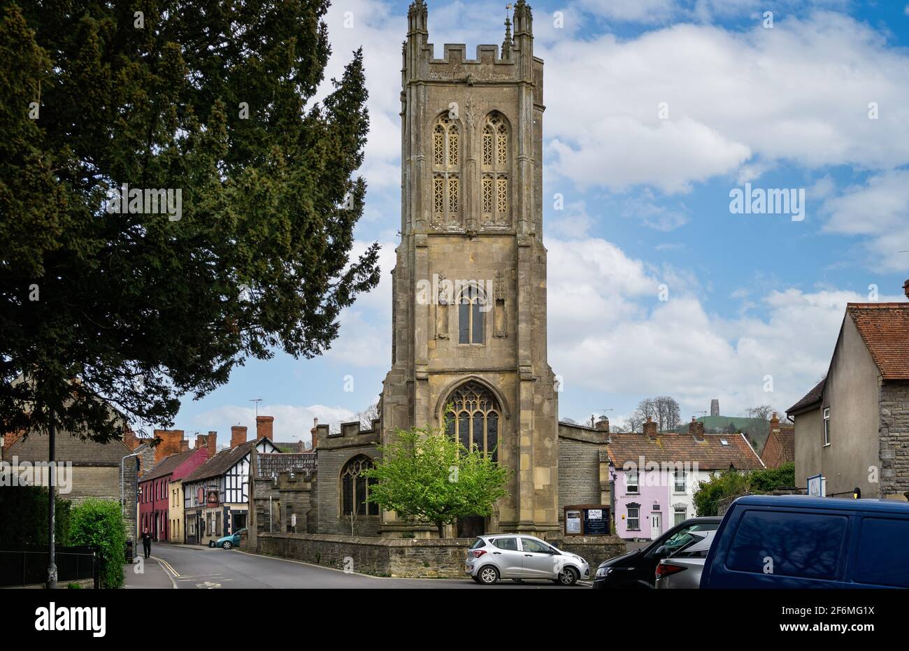 St Benedict's church with Glastonbury Tor in background in Glastonbury, Somerset, UK on 1 April 2021 Stock Photo