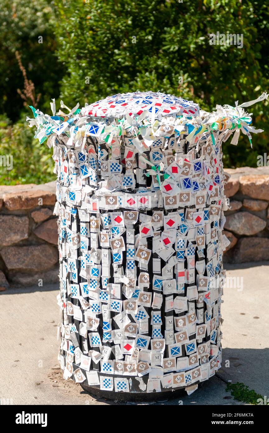 Used entry tickets to Mystic Seaport Museum in Connecticut are attached to a waste bin by tourists. USA Stock Photo