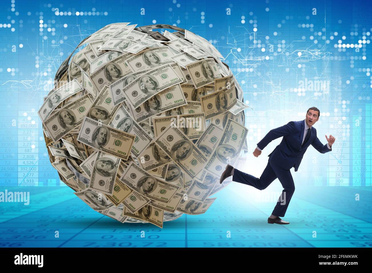 Businessman running away from the dollar ball Stock Photo - Alamy