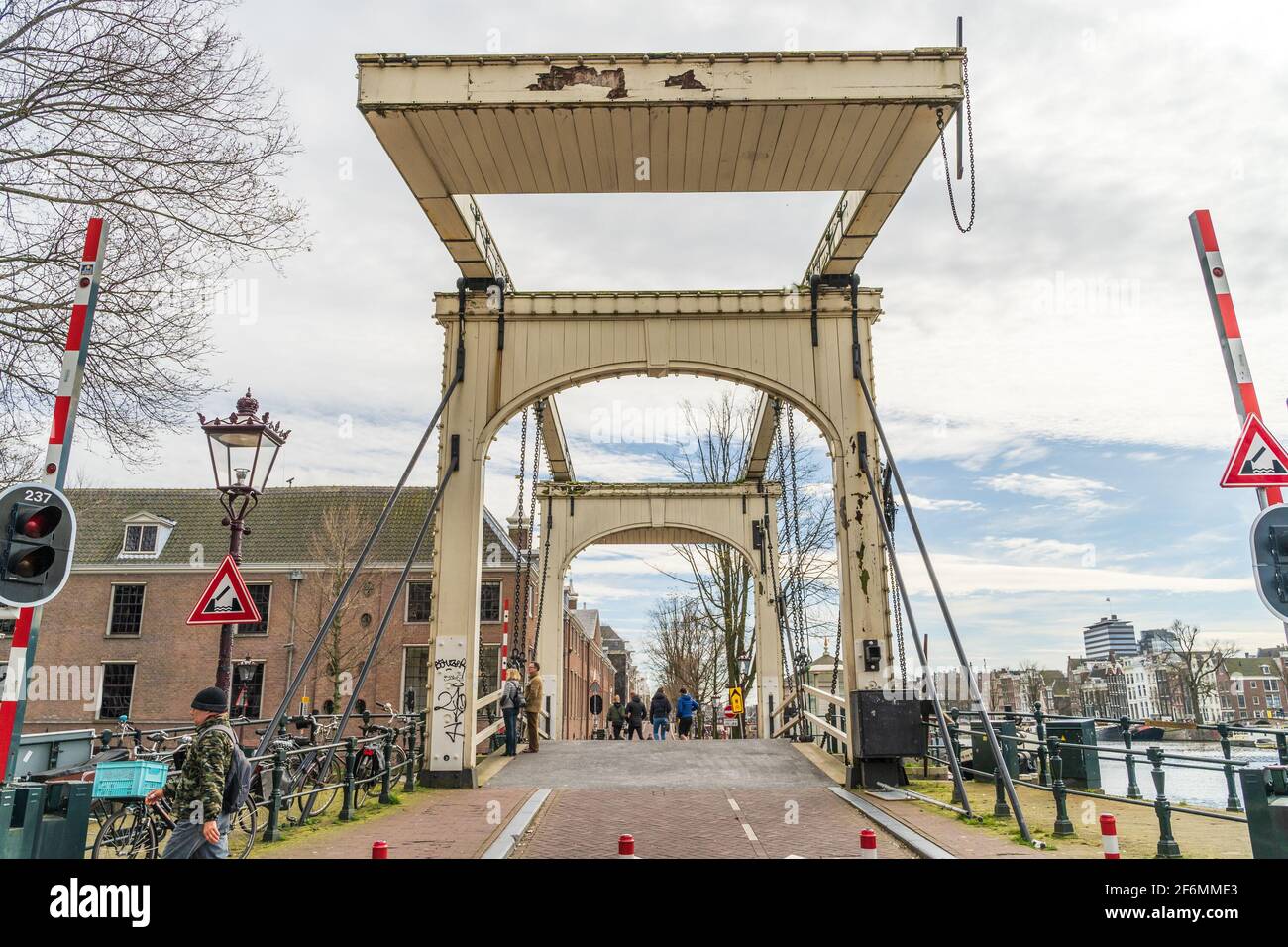Amsterdam, Netherlands - March 2020: Magere Brug or Skinny Bridge on Amstel river, bascule bridge made of white-painted wood. Stock Photo