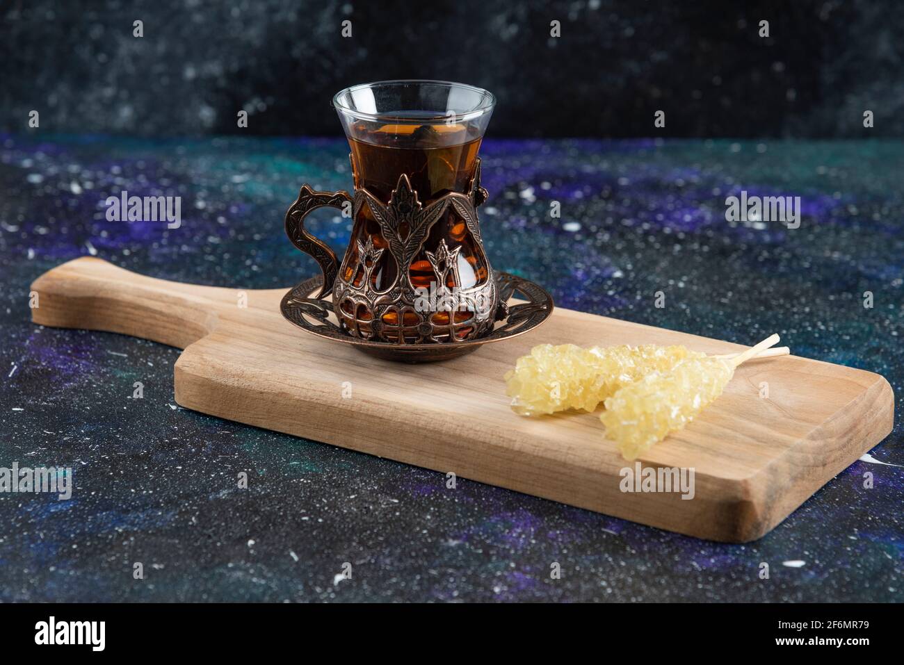 Dried mulberry with Fragrant tea on wooden board Stock Photo