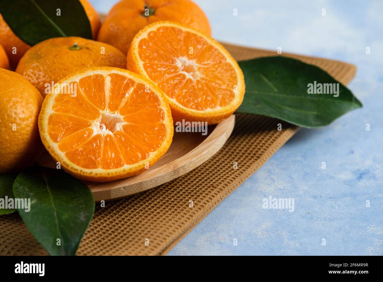 Close up photo of half cut fresh clementine mandarin Stock Photo
