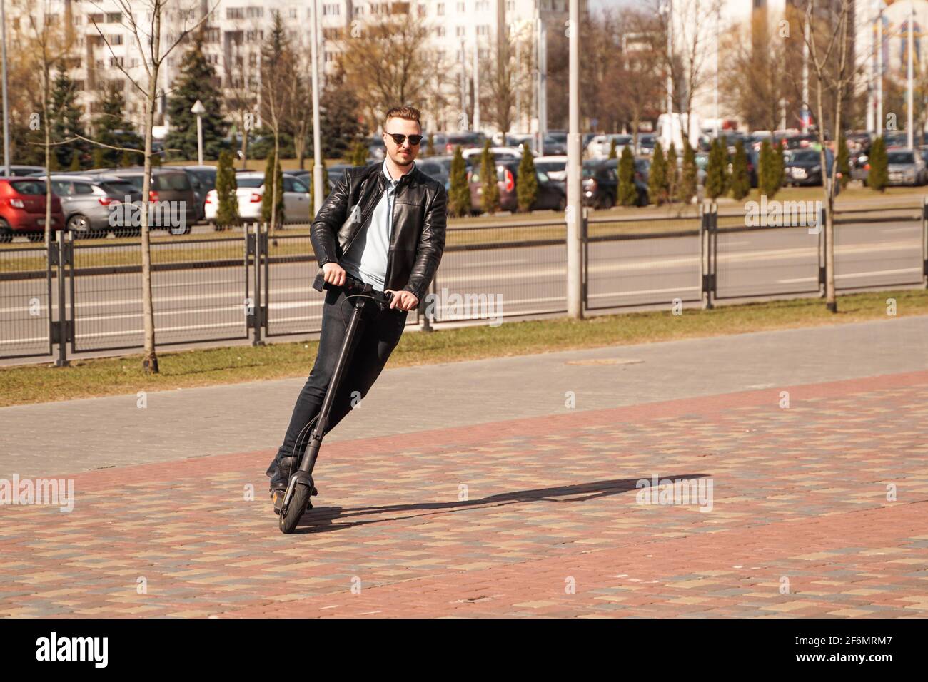 Man riding electric kick hi-res stock photography and images - Alamy