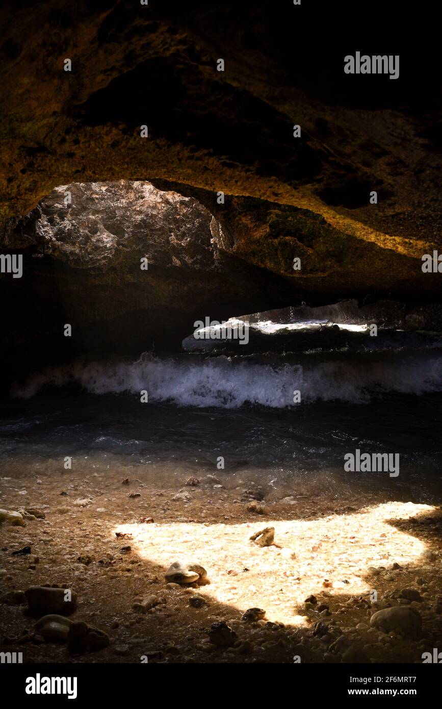 Spectacular Mermaid Caves with sunlight piercing through hole in