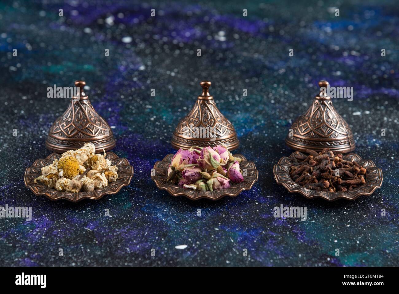 Different herbs and spices on blue background Stock Photo