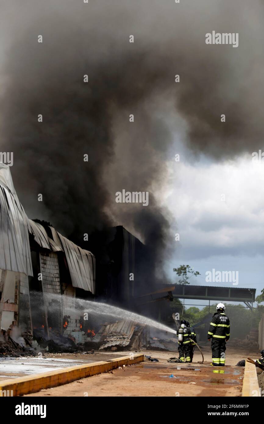 sao sebastiao do passe, bahia / brazil - may 31, 2019: members of the Fire Department are seen during a fire in a factory in the city of Sao Sebastiao Stock Photo