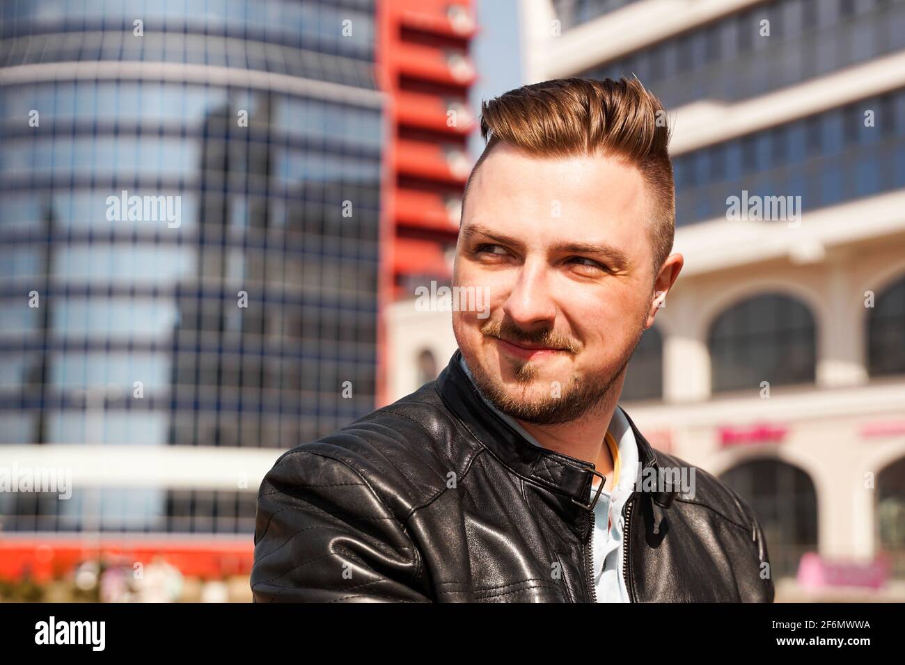 An attractive man wearing black leather jacket Stock Photo