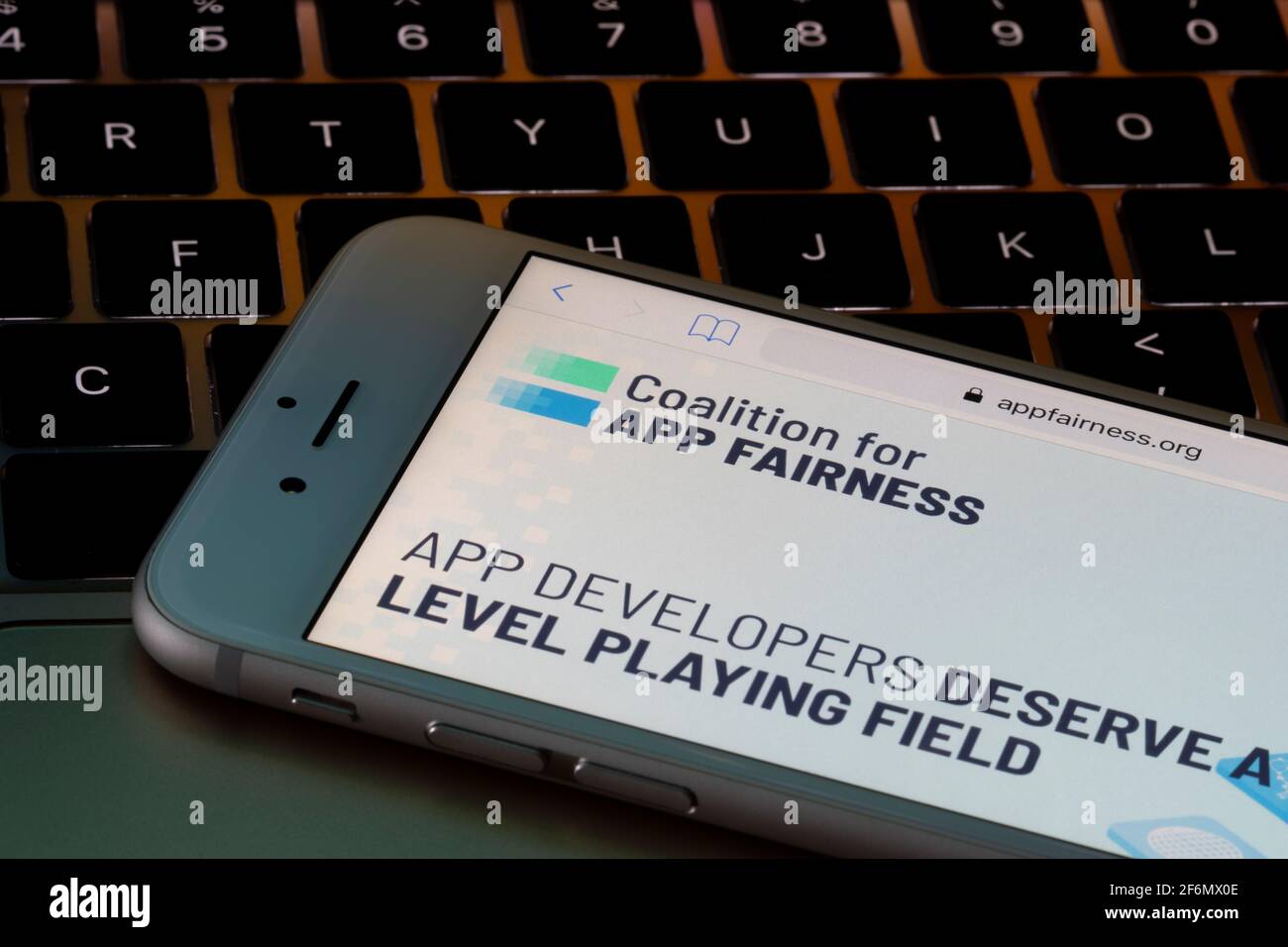 The homepage of the Coalition for App Fairness (CAF) website is seen on an iPhone. CAF is comprised by companies who aim to reach a fairer deal for ... Stock Photo