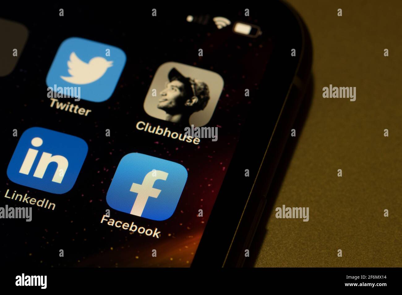 LinkedIn, FB, Twitter, Clubhouse apps seen on an iPhone. LinkedIn joins Twitter and Facebook in becoming another competitor of Clubhouse by testing... Stock Photo