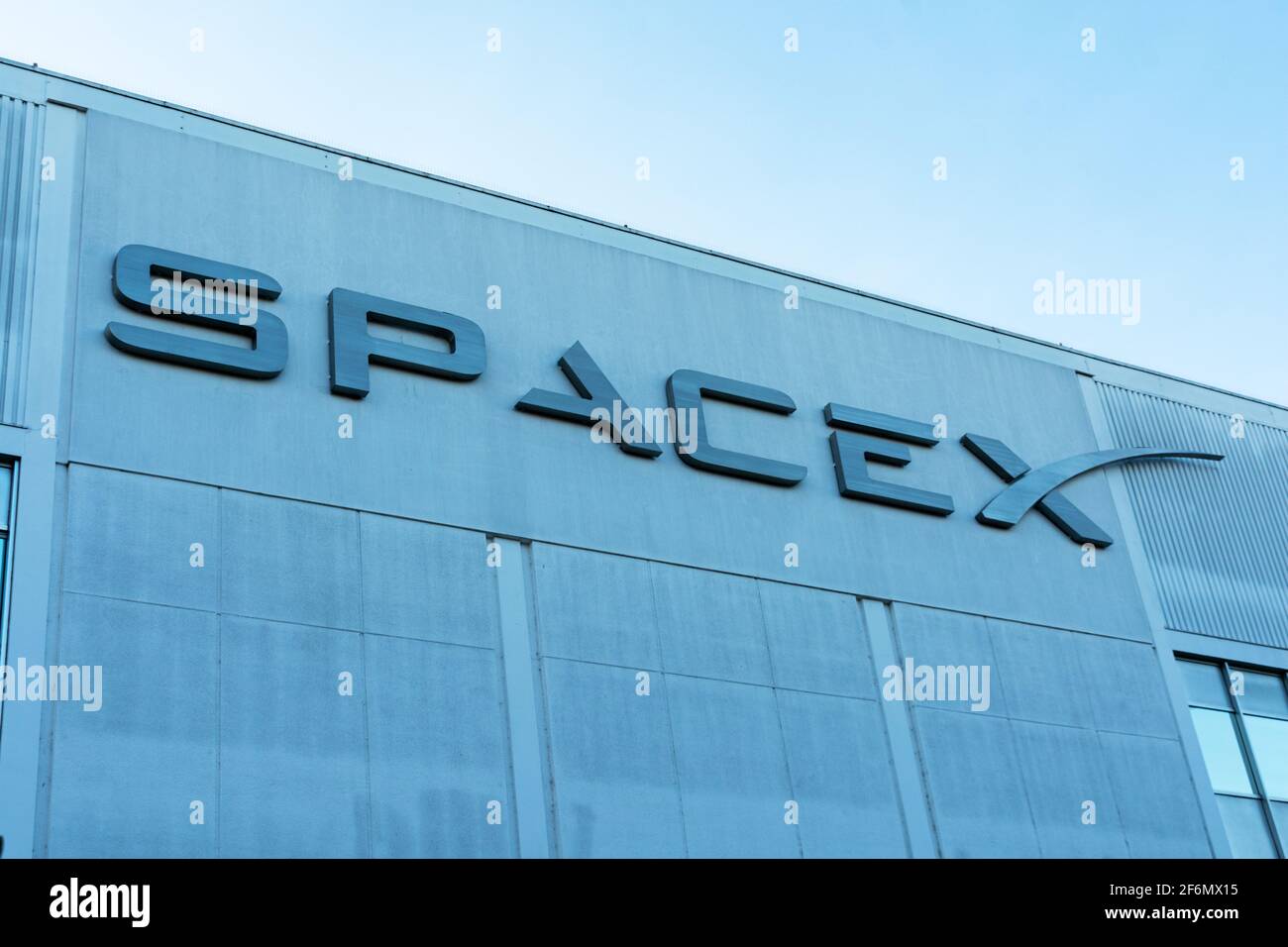 SpaceX sign logo on Space Exploration Technologies Corp headquarters building. SpaceX is private American aerospace manufacturer - Hawthorne, Californ Stock Photo