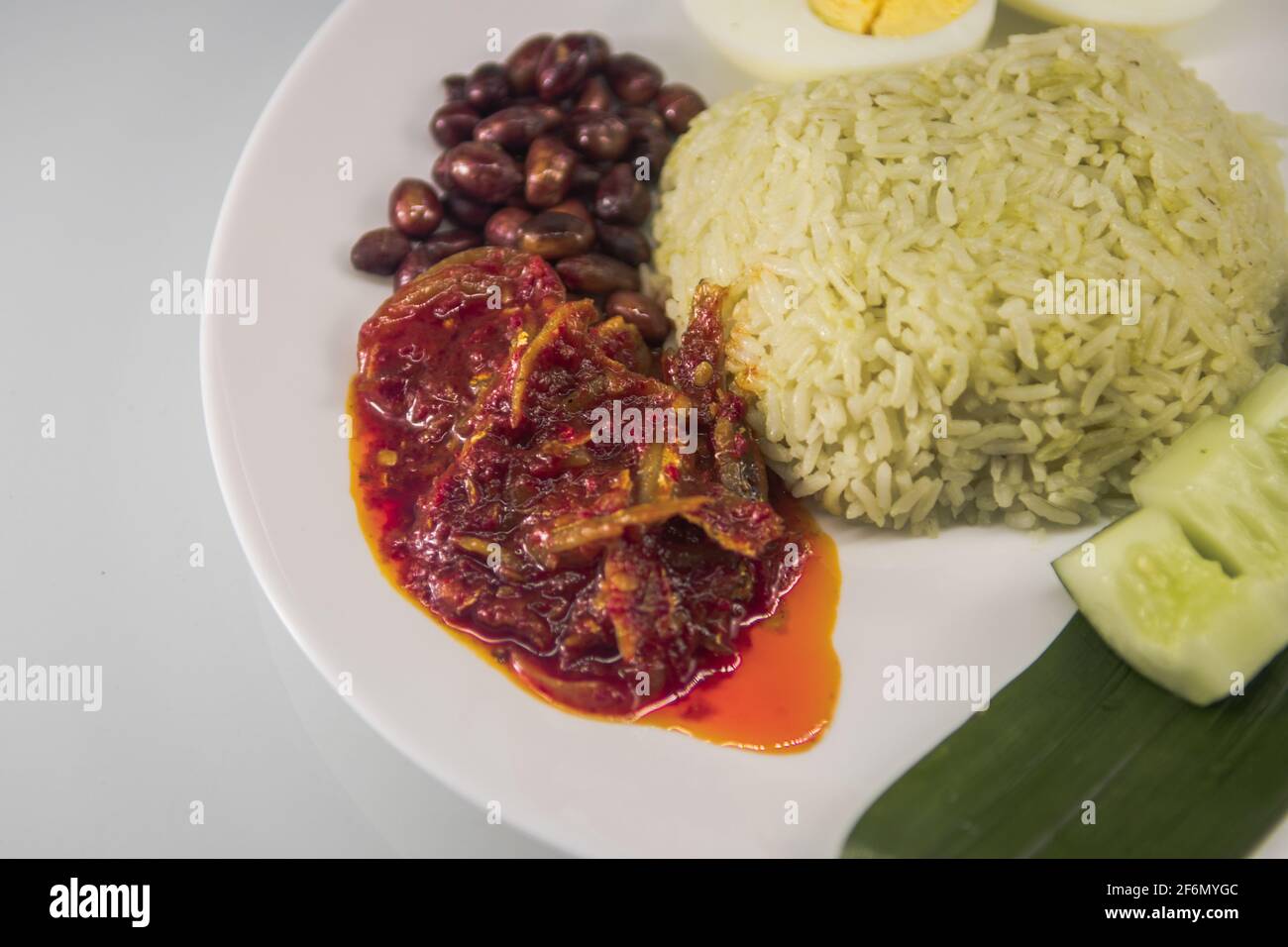 nasi lemak with close-up spicy anchovies yummy on blurred background Stock Photo