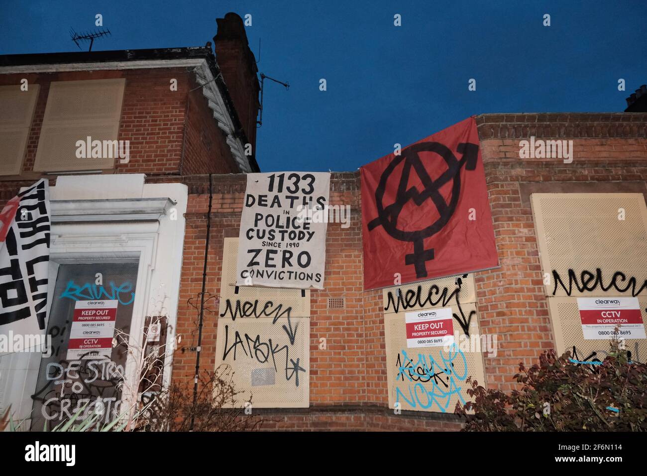 An anarchist group occupies a former police station close to where Sarah Everard was last seen in Clapham Common in protest against female violence. Stock Photo