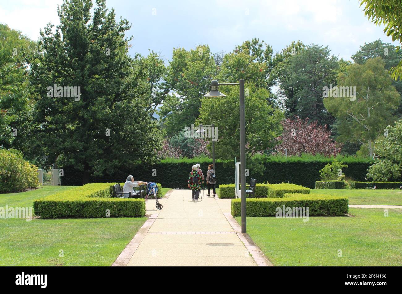 Asian People over Sixty, Senior Lifestyle, Enjoying a Walk in the Old Parliament House Gardens, Canberra, Australia. Stock Photo