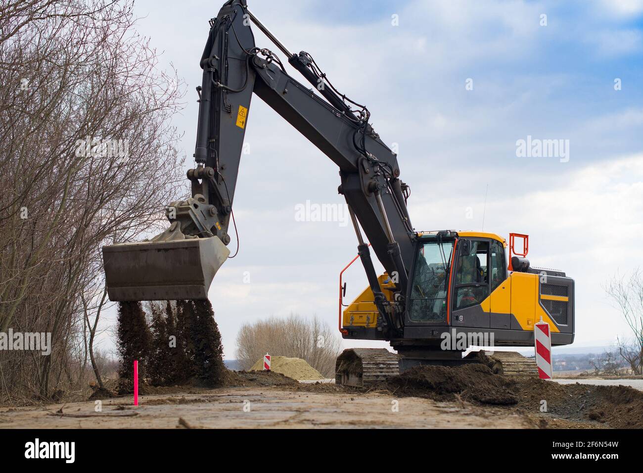 Road construction. Earth movement. Aclose up Stock Photo - Alamy
