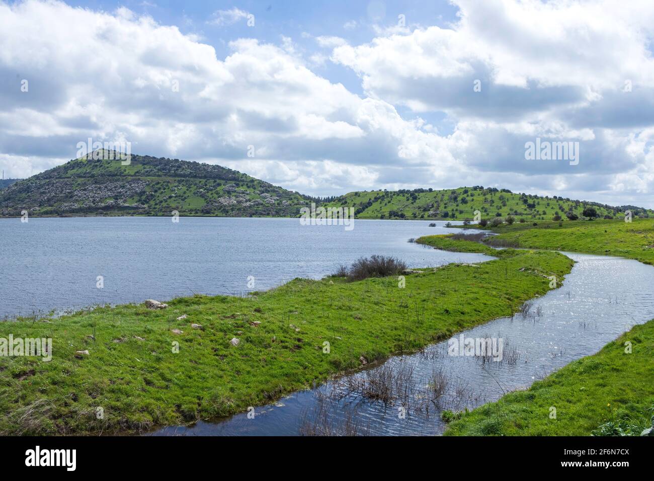 An artificial lake with a hill on the horizon Stock Photo