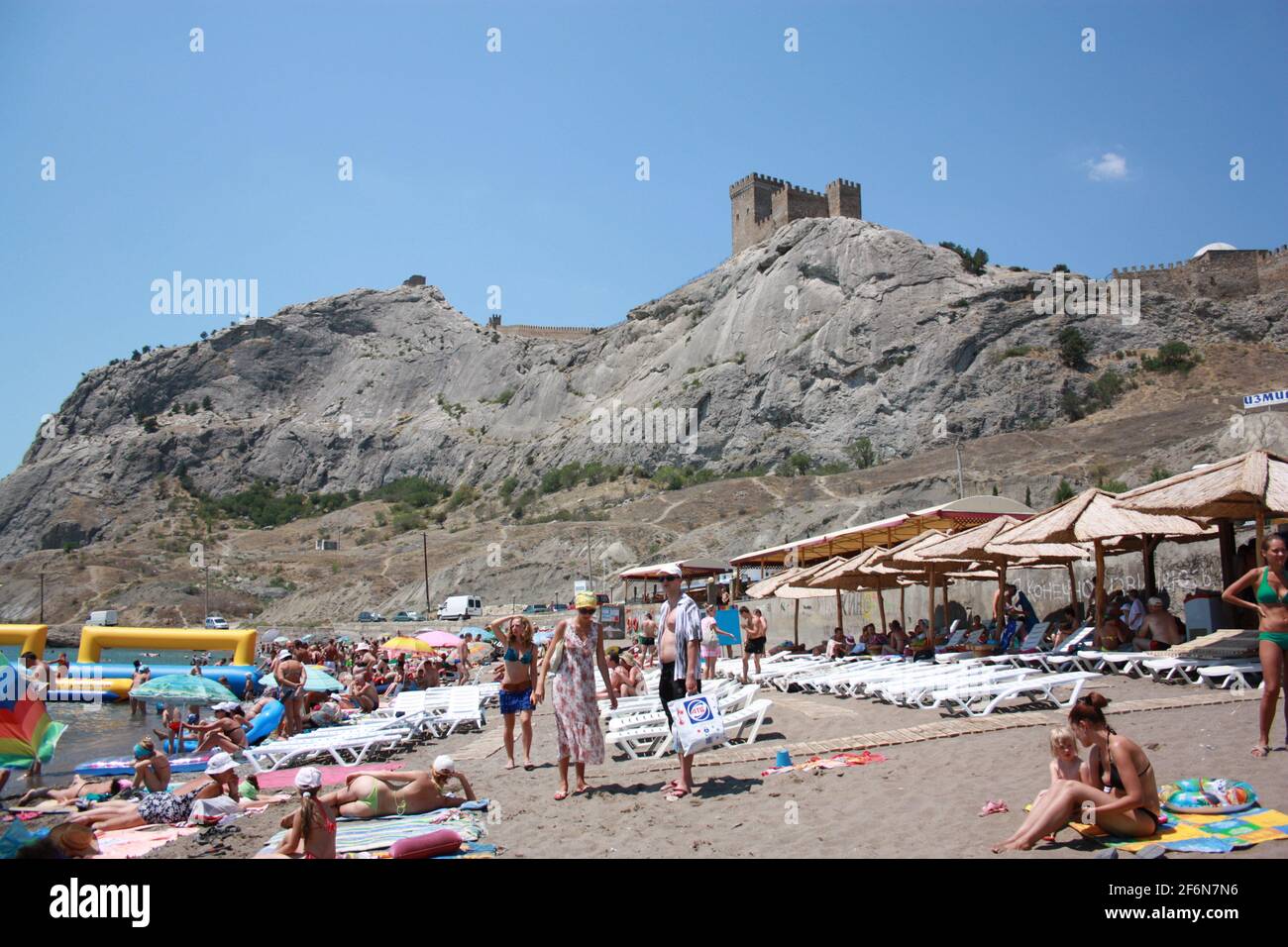 SUDAK, CRIMEA - June, 2012: View of the beach and the fortress Stock Photo