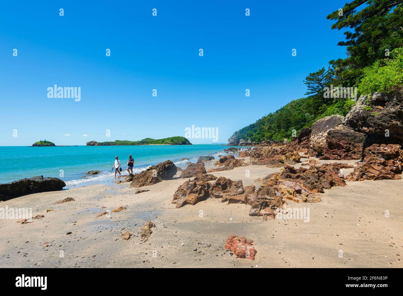 Persons walking on the beach in Cape Hillsborough National Park, Queensland, QLD, Australia Stock Photo