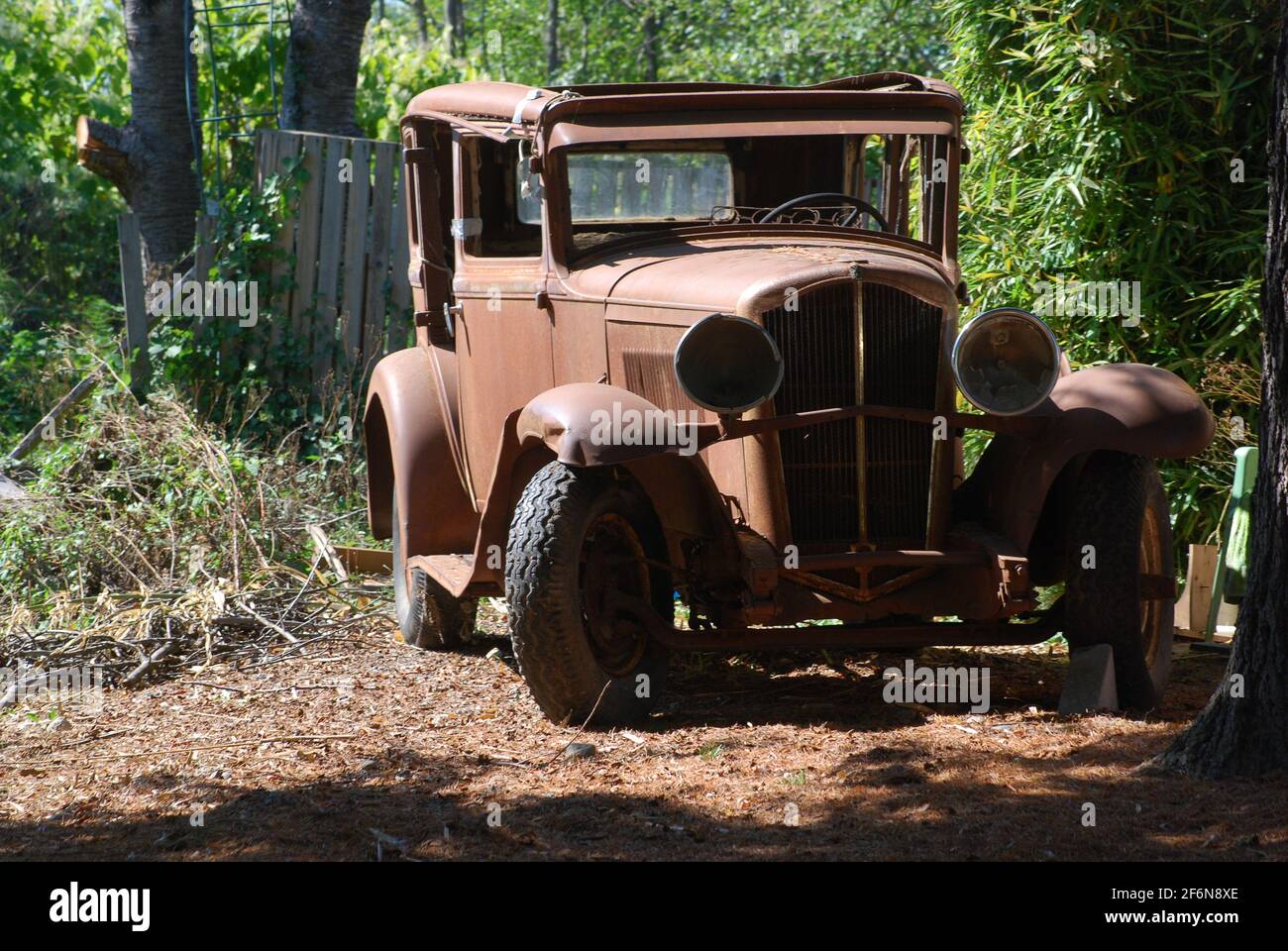 The rusted body of a once-gleaming 1927 Auburn 8-88 sits waiting for someone with the dedication to restore it to its original glory. Stock Photo